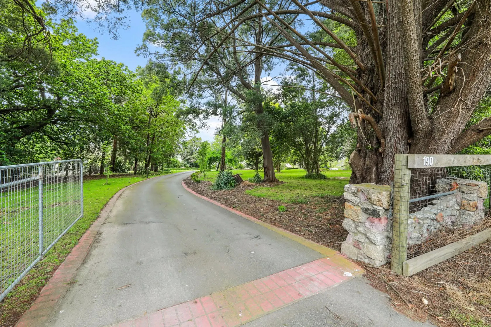 Driveway entrance with stone gate pillars